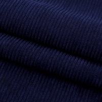 Close-up of folded Thick 8 Wale Corduroy Fabric By the Yard from Longan Craft, showing its dark blue color, soft texture, visible vertical ridges, and suitable for upholstery and dressmaking.