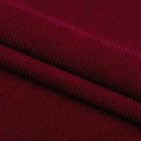 Close-up of Thick 8 Wale Corduroy Fabric by Longan Craft, showing its soft, ribbed dark red texture—ideal for dressmaking or upholstery. Available by the yard, perfect for detailed and durable projects.