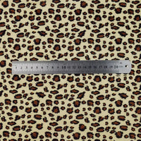 A 20cm metal ruler is placed on Longon Craft’s Animal Patterned Minky Fabric by the Yard, featuring a leopard dot cow print in shades of brown, black, and tan.