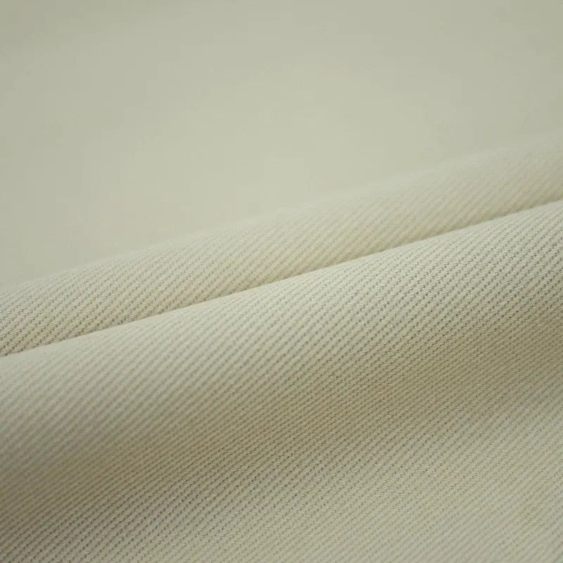 A close-up of Longan Craft's 7.5oz Colored Denim Fabric by the yard, 100% cotton twill with a subtle diagonal weave—perfect for colorful jeans, jackets, or summer dresses.