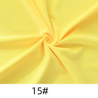 A yellow spiral-twisted piece of Longon Craft Minky Fabric By The Yard, Solid Color Thick Cuddle Minky, soft polyester for plushies and upholstery, with “15#” below.