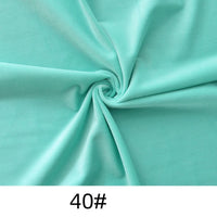 A swirl of light turquoise Longon Craft Minky Fabric By The Yard, a thick plush polyester for dolls and crafts, is shown with the number "40#" at the bottom.