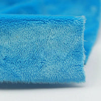 Close-up of Longon Craft Plush Minky Fabric by the Yard in bright blue, featuring 5mm soft polyester for a cozy, fuzzy texture—ideal solid color material for plushies, baby blankets, sewing, and crafts.