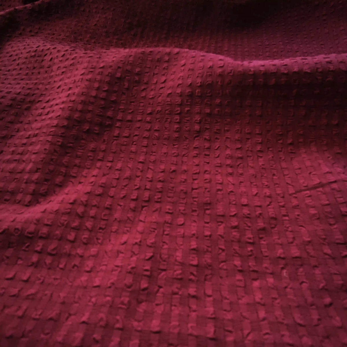 Close-up of Longan craft's Check Seersucker Fabric by the Yard, a textured plaid gingham material with a puckered, grid-like pattern that adds depth and softness.
