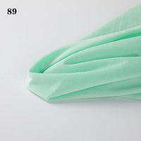 Soft mint green Longon Craft Soft Minky Fabric By The Yard (1mm Minky Cuddle Doll Plushies Material) draped on a white surface, with the number 89 in black text in the upper left corner.