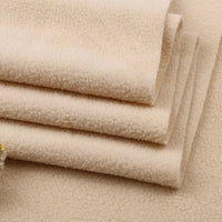 Close-up of several folded pieces of Longon Craft Solid Polar Fleece Fabric By The Yard, showcasing its thick, plush 100% polyester texture—perfect for blankets, DIY sewing, crafts, and upholstery projects.