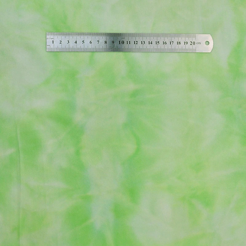 A silver 20 cm ruler rests on Longon Craft Tie Dye Minky Fabric By The Yard, a rainbow printed minky fleece ideal for DIY plushies, toys, and clothing. The pale green and white marbled background highlights the clear centimeter markings.