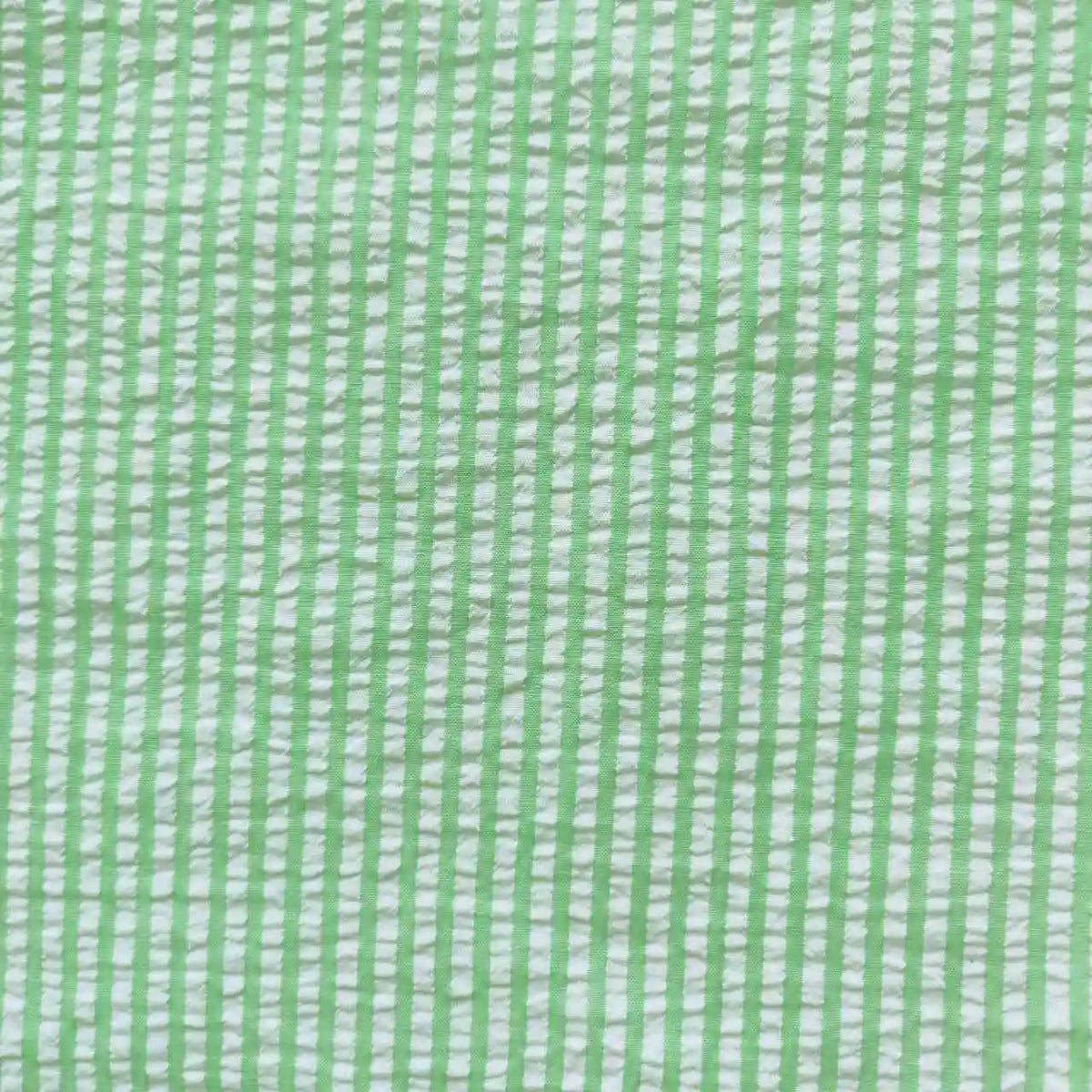 Close-up of Longan Craft's Stripe Seersucker Fabric, featuring a colorful striped polyester-cotton design. The breathable material is perfect for summer and sold by the yard.