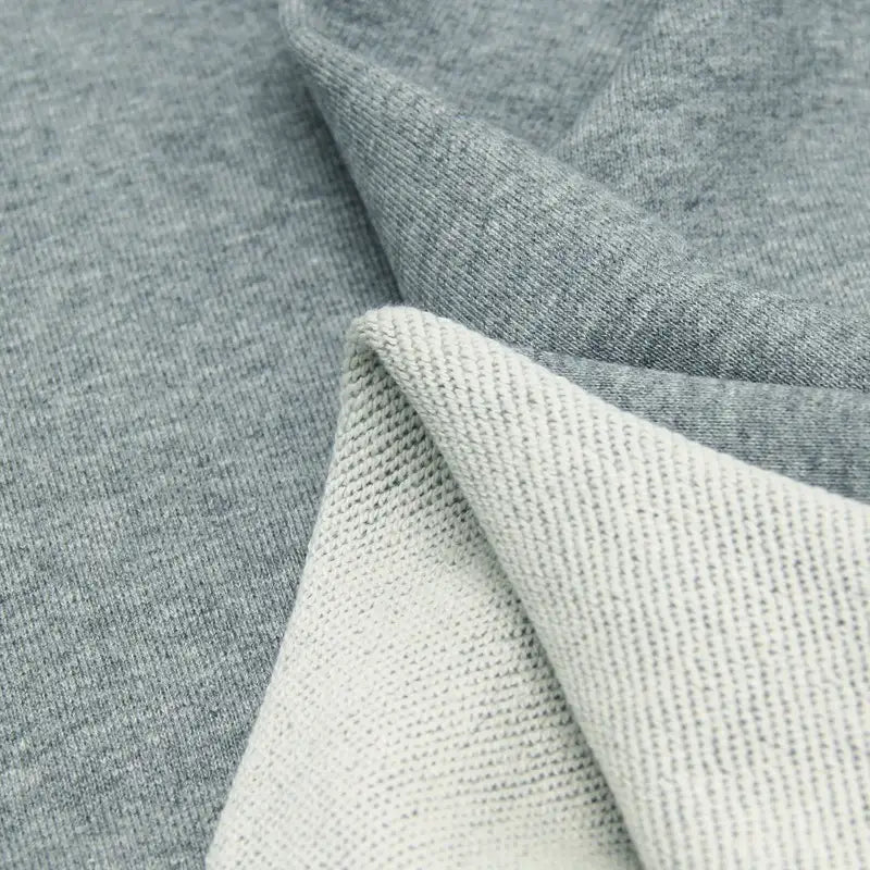 Close-up of Solid Color Cotton French Terry Fabric by the yard from Longan Craft, highlighting its thick construction with smooth outer side and textured inner side—ideal French terry material for hoodies.