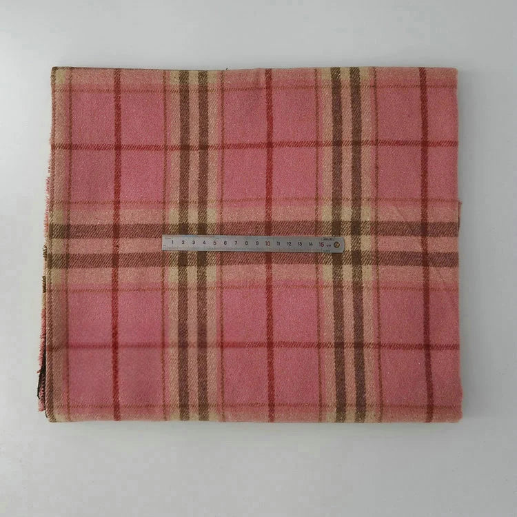 A folded piece of Longan Craft Multicolor Plaid Mammoth Flannel Fabric by the yard is displayed on a white surface, with a 20 cm metal ruler across the brushed polyester cotton textile for scale.