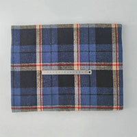 A Multicolor Plaid Mammoth Flannel Fabric by Longan Craft is displayed flat on a light surface, with a 20cm ruler across its center for scale. This brushed polyester cotton textile is ideal for comfy shirts and sold by the yard.