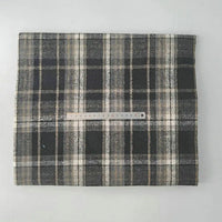 A neatly folded Longan Craft Multicolor Plaid Mammoth Flannel Fabric By The Yard, a brushed polyester-cotton textile for shirts, is shown with a ruler for scale against a light background.
