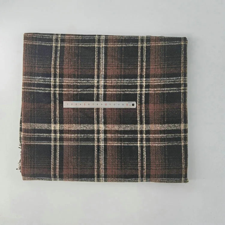 A piece of Longan Craft Multicolor Plaid Mammoth Flannel Fabric, a cozy brushed polyester-cotton textile for shirts, is shown folded with a ruler on top to display size in centimeters.