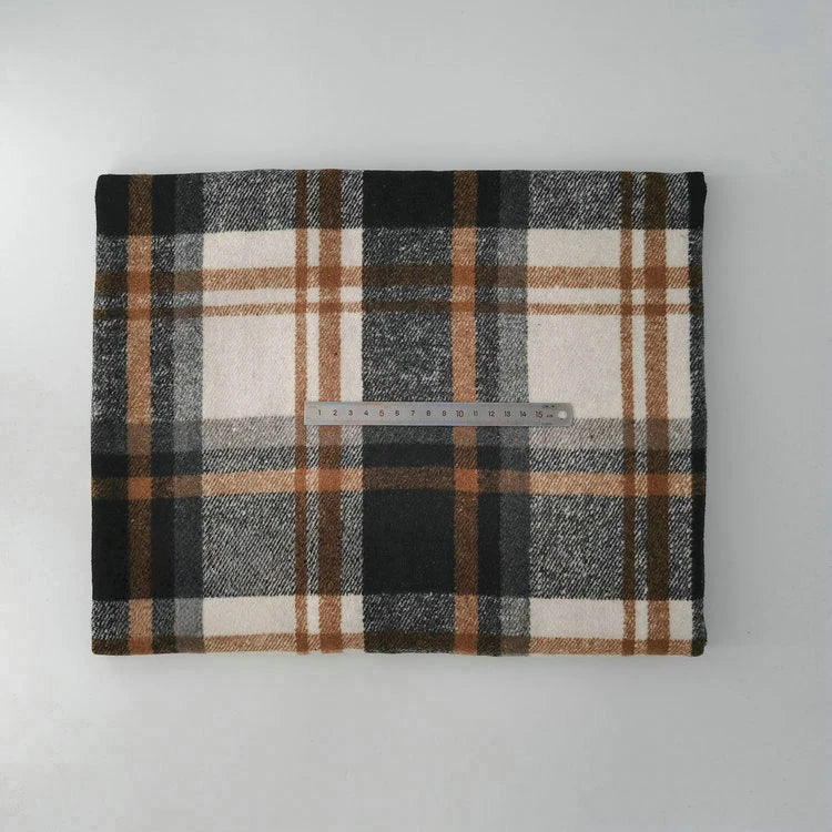 A folded Longan Craft Multicolor Plaid Mammoth Flannel Fabric By The Yard lies on a flat surface, with a transparent 30 cm ruler placed horizontally across the center to show scale.