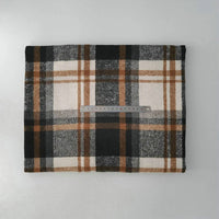 A folded Longan Craft Multicolor Plaid Mammoth Flannel Fabric By The Yard lies on a flat surface, with a transparent 30 cm ruler placed horizontally across the center to show scale.