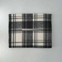 A piece of Longan Craft’s Multicolor Plaid Mammoth Flannel Fabric by the yard, a comfy brushed polyester-cotton blend for shirts, is folded on a light surface with a ruler across its center to show width.