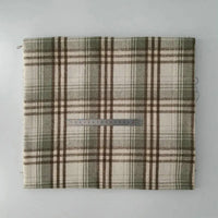 A piece of Longan Craft Multicolor Plaid Mammoth Flannel Fabric By The Yard, a comfy brushed polyester-cotton textile for shirts, lies flat with a ruler across the center for scale.
