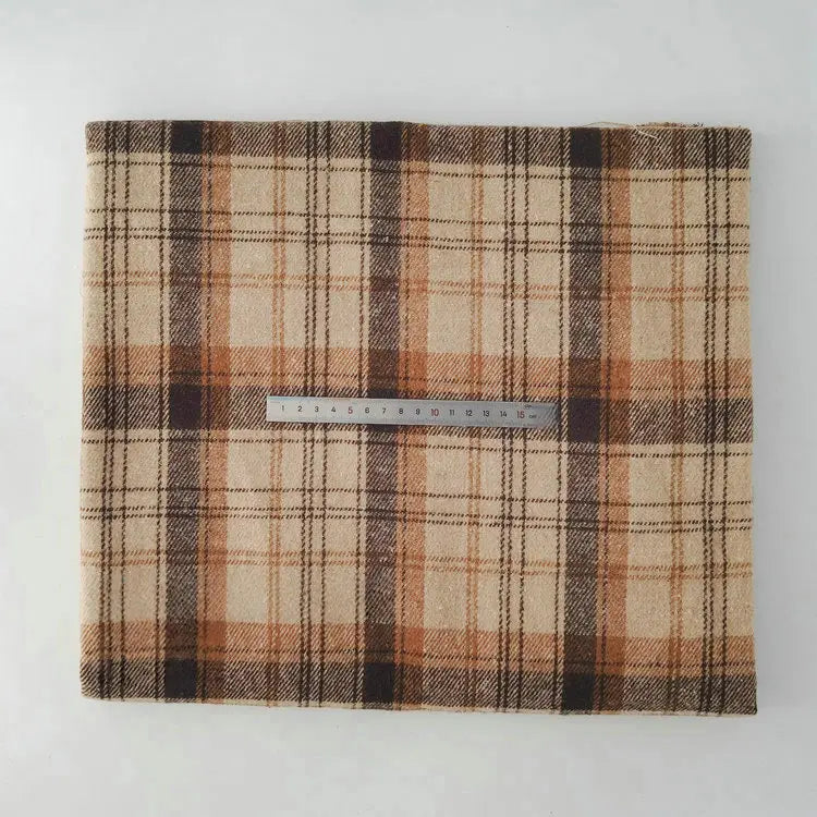 The Longan Craft Multicolor Plaid Mammoth Flannel Fabric by the Yard—a brushed polyester cotton blend ideal for shirts—is shown folded on a white surface with a 30 cm silver ruler placed across for scale.
