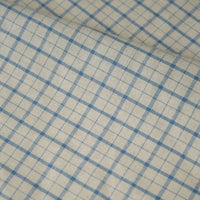 A close-up of the Longan Craft 100% Cotton Gingham Poplin Fabric by the yard reveals a multicolor yarn-dyed checkered pattern, featuring intersecting blue horizontal and vertical lines that form small squares on a beige background. The premium soft poplin material has a slightly wrinkled surface, ideal for garment making.