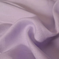 Close-up of Longan Craft's 100 Linen Fabric By The Yard in light purple, showing its soft, flowing, and slightly translucent lightweight texture—ideal as a comfortable solid color material for summer projects.