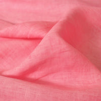 A close-up of Longan Craft’s 100 Linen Fabric By The Yard shows soft, pink, lightweight linen with a visible weave and gentle folds—perfect as a comfortable summer linen material.