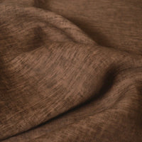 A close-up of Longan Craft’s 100 Linen Fabric By The Yard in solid color, gently draped to display its soft folds and lightweight texture—perfect for comfortable summer projects.