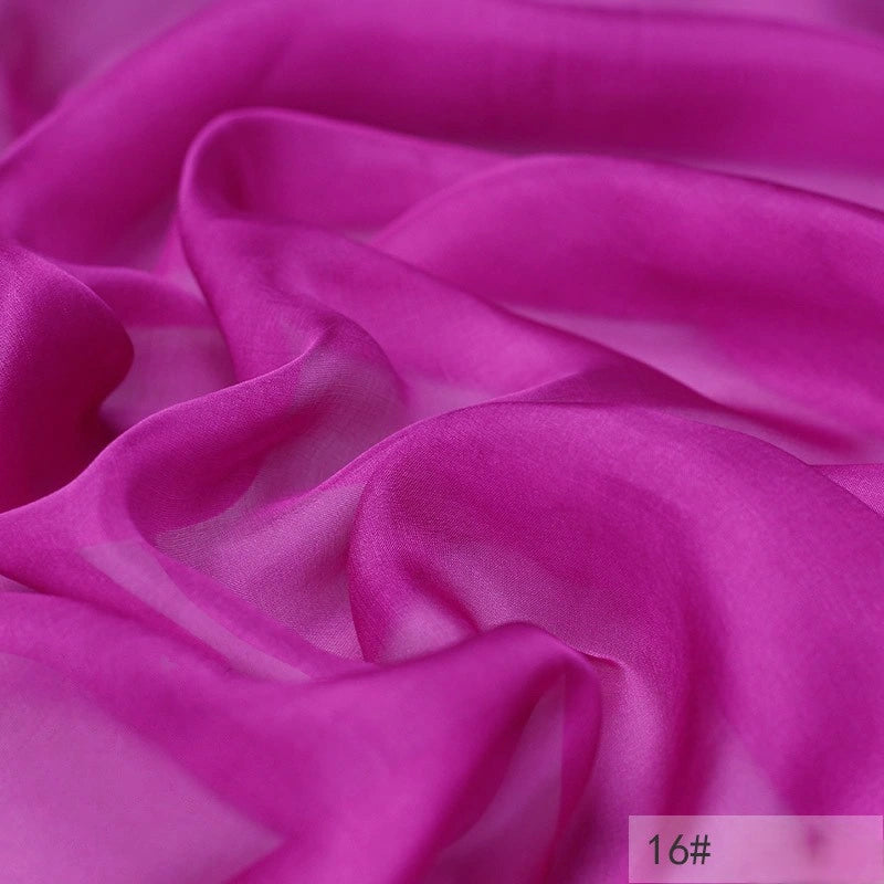 Vibrant magenta 100 Mulberry Silk Chiffon Fabric by Longan Craft, lightweight and flowing with gentle folds; ideal for dresses. Small corner label shows “16#”.