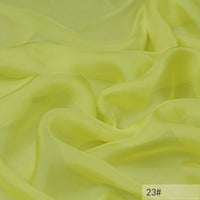 Light yellow, semi-transparent 100 Mulberry Silk Chiffon Fabric by Longan Craft with soft folds and smooth texture, perfect for dresses. The bottom right corner shows the label 23#.