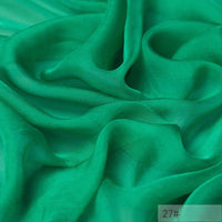 Bright green, semi-sheer 100 Mulberry Silk Chiffon Fabric by the yard from Longan Craft with soft, flowing folds and a smooth texture; “27#” appears in the bottom right corner. Ideal for colorful dresses.