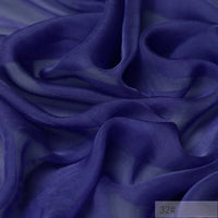A close-up of Longan Craft’s 100% Mulberry Silk Chiffon Fabric By The Yard—lightweight, sheer, and flowing chiffon in deep purple. This colorful chiffon material is perfect for dresses, catching light to showcase its delicate texture and depth.