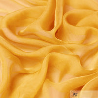 A close-up of yellow, semi-transparent 100 Mulberry Silk Chiffon Fabric by Longan Craft, softly draped in flowing folds. The lightweight chiffon is perfect for dresses. The label 9# appears in the bottom right corner.