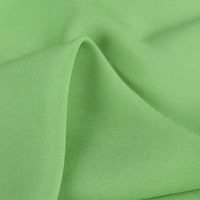 A close-up of Longan Craft 100% Rayon Fabric by the Yard shows its smooth, soft, lightweight viscose texture and gentle folds—perfect for dressmaking and clothing projects.