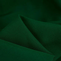 A close-up of Longan Craft’s 100 Rayon Fabric By The Yard in dark green, a silky-smooth, soft, solid color viscose perfect for dressmaking and clothing.