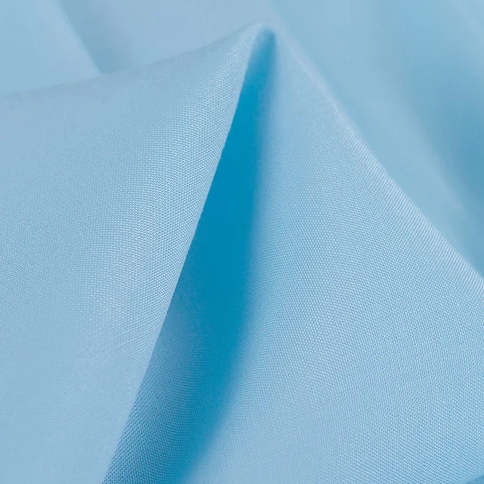 A close-up of Longan Craft's 100 Rayon Fabric By The Yard reveals its soft, silky-smooth texture with a gentle sheen and subtle folds. This solid color viscose material is lightweight, breathable, and ideal for dressmaking projects.
