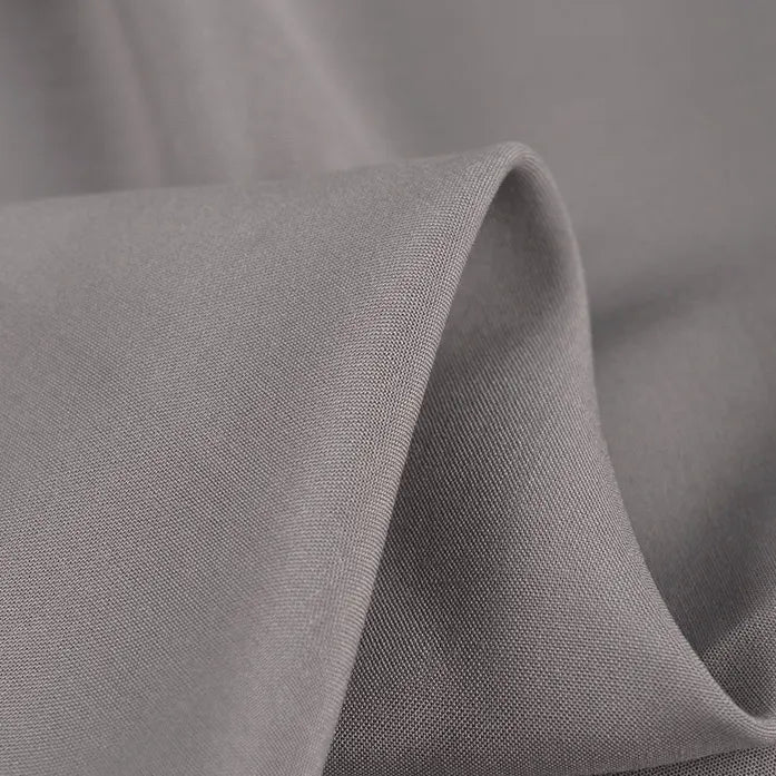 Close-up of Longan Craft 100% Rayon Fabric by the Yard—solid color viscose clothing material with a soft texture, subtle sheen, gentle folds for flexibility, and lightweight breathability—ideal for dressmaking.