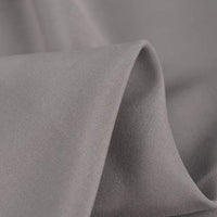 Close-up of Longan Craft 100% Rayon Fabric by the Yard—solid color viscose clothing material with a soft texture, subtle sheen, gentle folds for flexibility, and lightweight breathability—ideal for dressmaking.