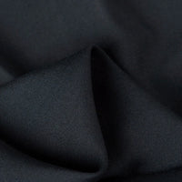 A close-up of Longan Craft's 100% Rayon Fabric By The Yard reveals its smooth, soft texture and subtle sheen—ideal as a breathable solid color viscose material for comfortable dressmaking and clothing projects.