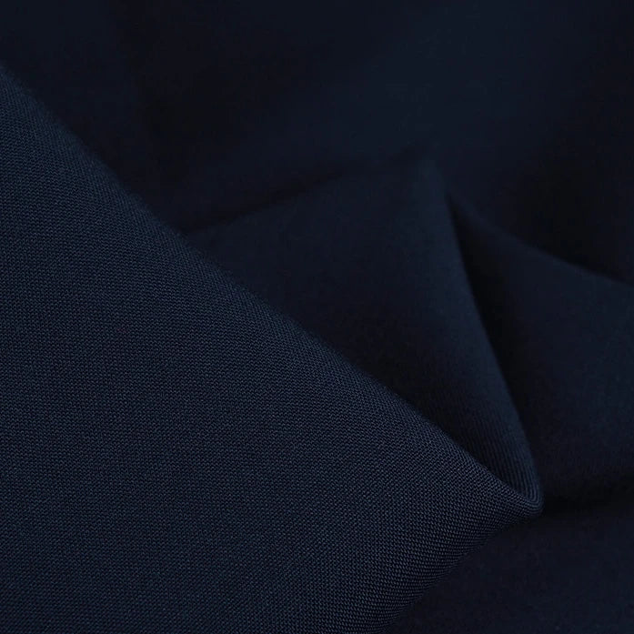 A close-up of Longan Craft’s 100 Rayon Fabric By The Yard reveals its silky-smooth texture, fine weave, and gentle folds, showcasing the lightweight, breathable quality of this solid color viscose dressmaking material.