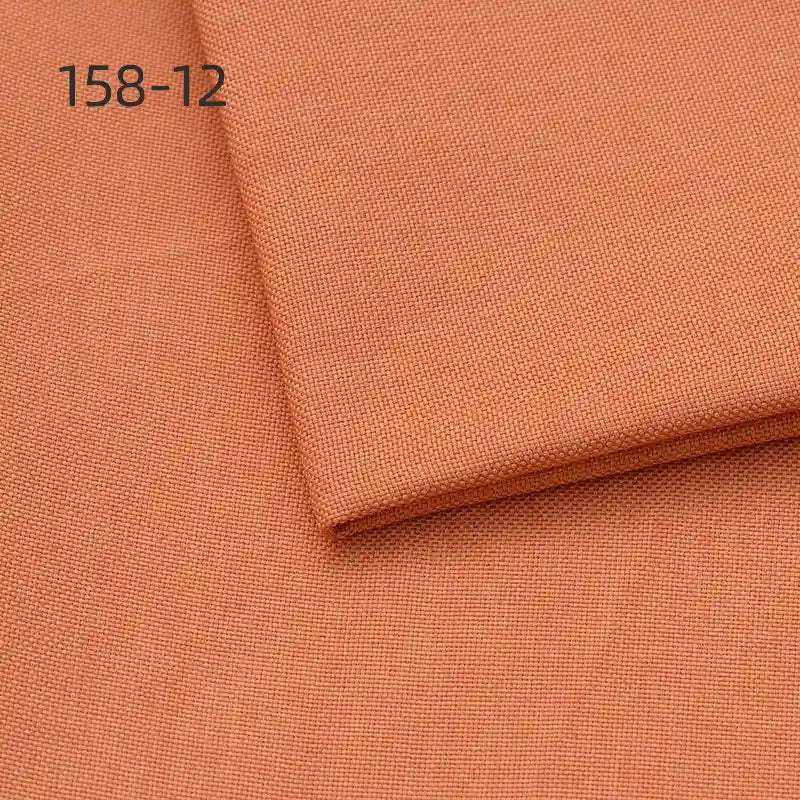 Two pieces of Longan Craft Faux Linen Upholstery Fabric (158-12) in light brown or terracotta are stacked and neatly folded. The polyester fabric features a fine, even weave—ideal for upholstering chairs, sofas, or curtains.