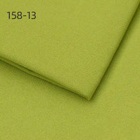 Two pieces of Longan Craft Faux Linen Upholstery Fabric (Polyester) in light green are layered, with code 158-13 shown in the upper left corner. Perfect for reupholstering chairs, sofas, or curtains by the yard.