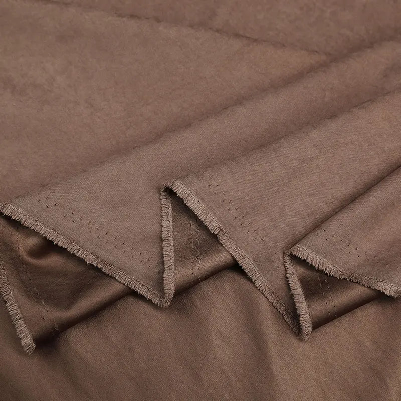 Close-up of Longan Craft Multi Color Microsuede Polyester Peachskin Fabric by the yard, featuring a brushed texture, matte finish, and raw edges—cozy peachskin material ideal for clothing.