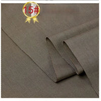 A close-up of Longan Craft’s Twill Cotton Lyocell Fabric By The Yard, a comfy and breathable solid color textile for shirts with a smooth brown finish, neatly folded. Top left shows a gold ribbon icon with 15# in a red circle.