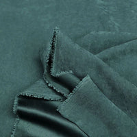 Longan Craft Multi Color Microsuede Polyester Peachskin Fabric by the yard features a brushed peach skin texture and cozy material, perfect for clothing, shown loosely folded to display its softness and thickness.