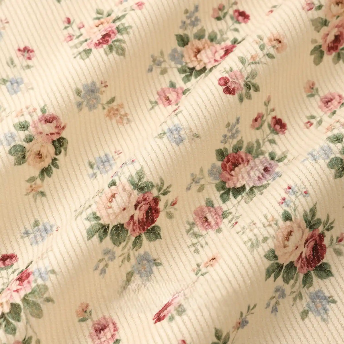Longan Craft 16 Wale Floral Printed Corduroy Fabric By The Yard features colorful flowers on cream fine wale corduroy—perfect for casual wear and sewing projects needing premium, softly draped material.