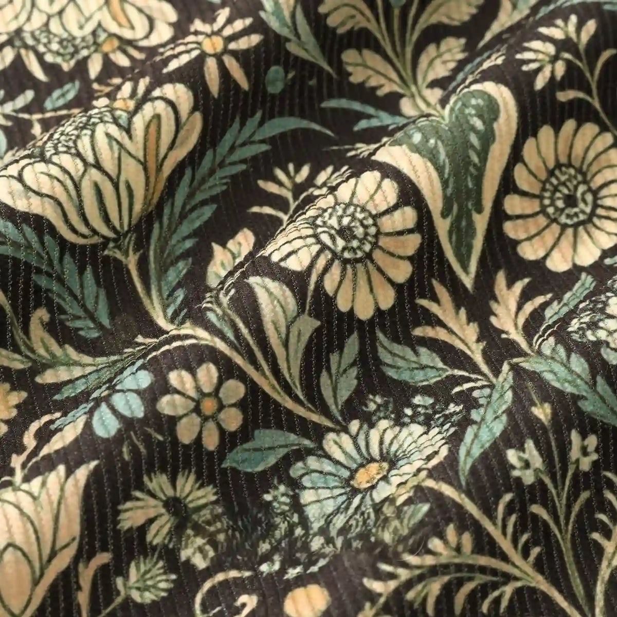 Close-up of Longan Craft 16 Wale Floral Printed Corduroy Fabric by the yard, featuring cream and light green flowers on a dark background. This premium, colorful fine wale textile is perfect for casual wear with its elegant printed pattern.