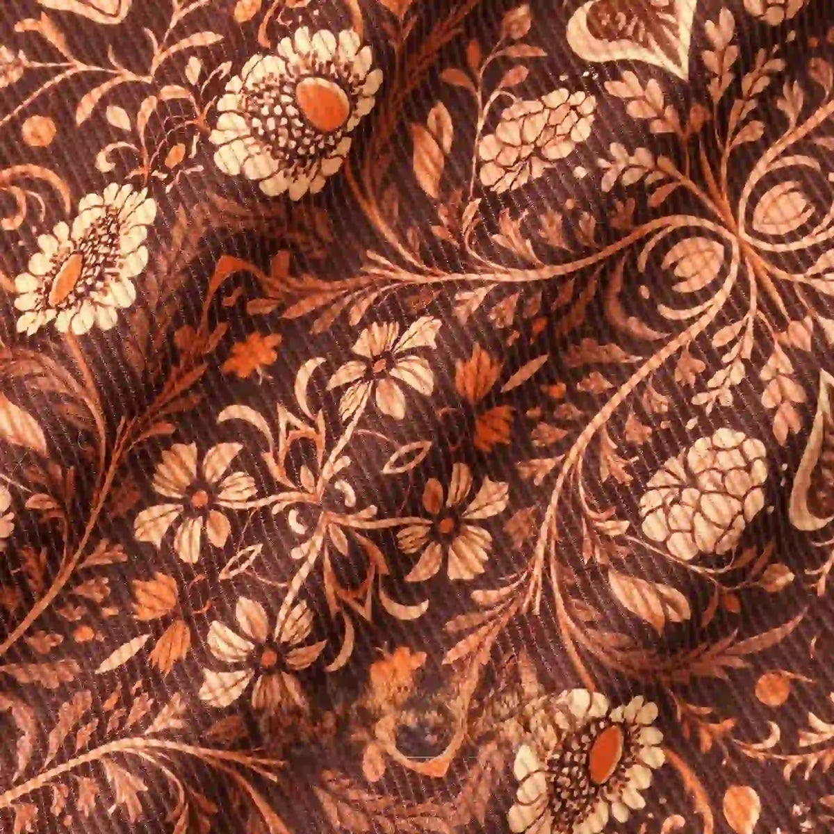Close-up of 16 Wale Floral Printed Corduroy Fabric by Longan Craft, featuring a detailed vintage pattern with cream and orange flowers, leafy branches, and swirling vines—premium material for casual wear.