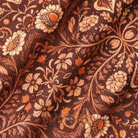 Close-up of 16 Wale Floral Printed Corduroy Fabric by Longan Craft, featuring a detailed vintage pattern with cream and orange flowers, leafy branches, and swirling vines—premium material for casual wear.
