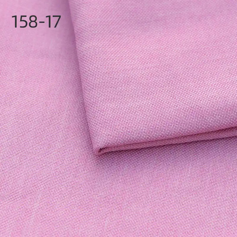 Close-up of two pieces of Longan Craft Faux Linen Upholstery Fabric By The Yard, one folded over the other, with "158-17" in the top left corner. Made of polyester, the pink fabric features a fine, smooth texture ideal for furniture or curtains.