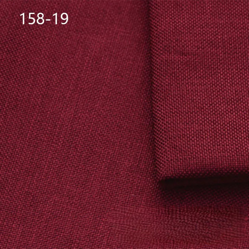 Close-up of Longan Craft Faux Linen Upholstery Fabric, deep red polyester for furniture, with one piece folded on top. "158-19" is displayed in white text at the top left.