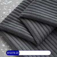 Two folded, dark gray towels resembling Longan Craft's 2.5 Wale Corduroy Fabric By The Yard are stacked on a speckled surface. A white label with blue border and text SY1078-20 is visible at the bottom.